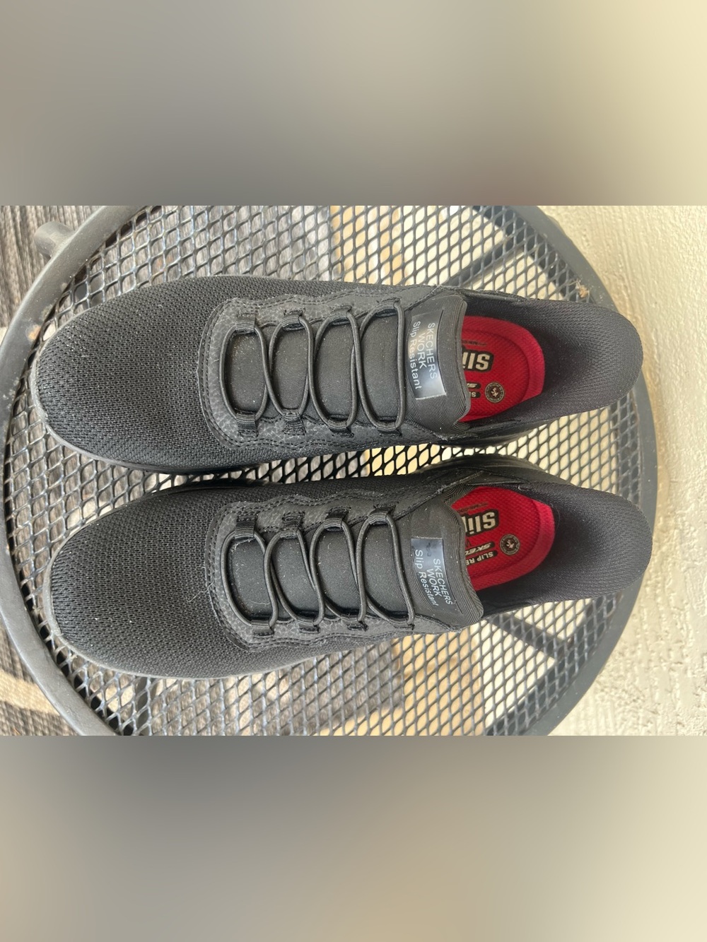 Skechers women’s Black Slip-On non skid Sneakers with Red Insole Accents